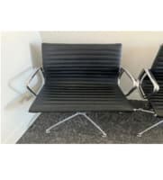 Meeting chair upholstered in black leather